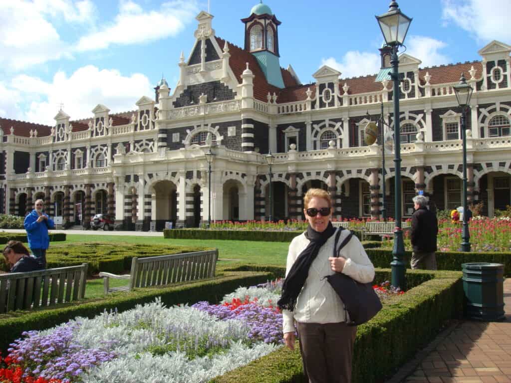 The beautiful gardens outside Dunedin Railway Station and Pam of course.