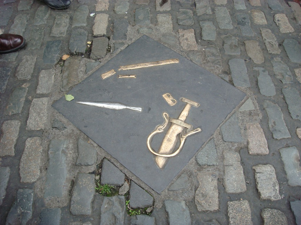 Copies of Roman artefacts are cast into the footpaths in the old part of Dublin. 2011
