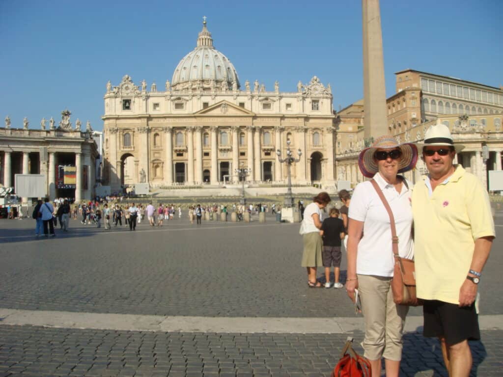 Pam and Michael in Saint Peter's Square, The Basilica in the background, The Papal City.  2011