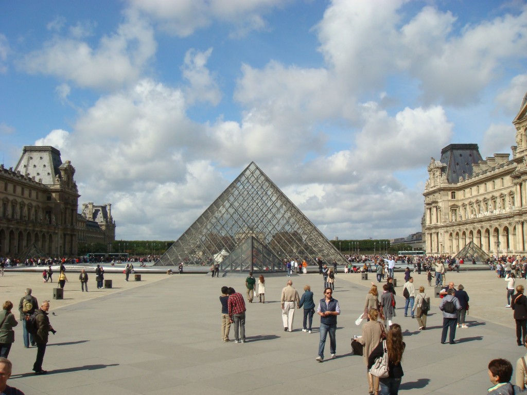 Walking the courtyard of the Louvre, Paris.  2011