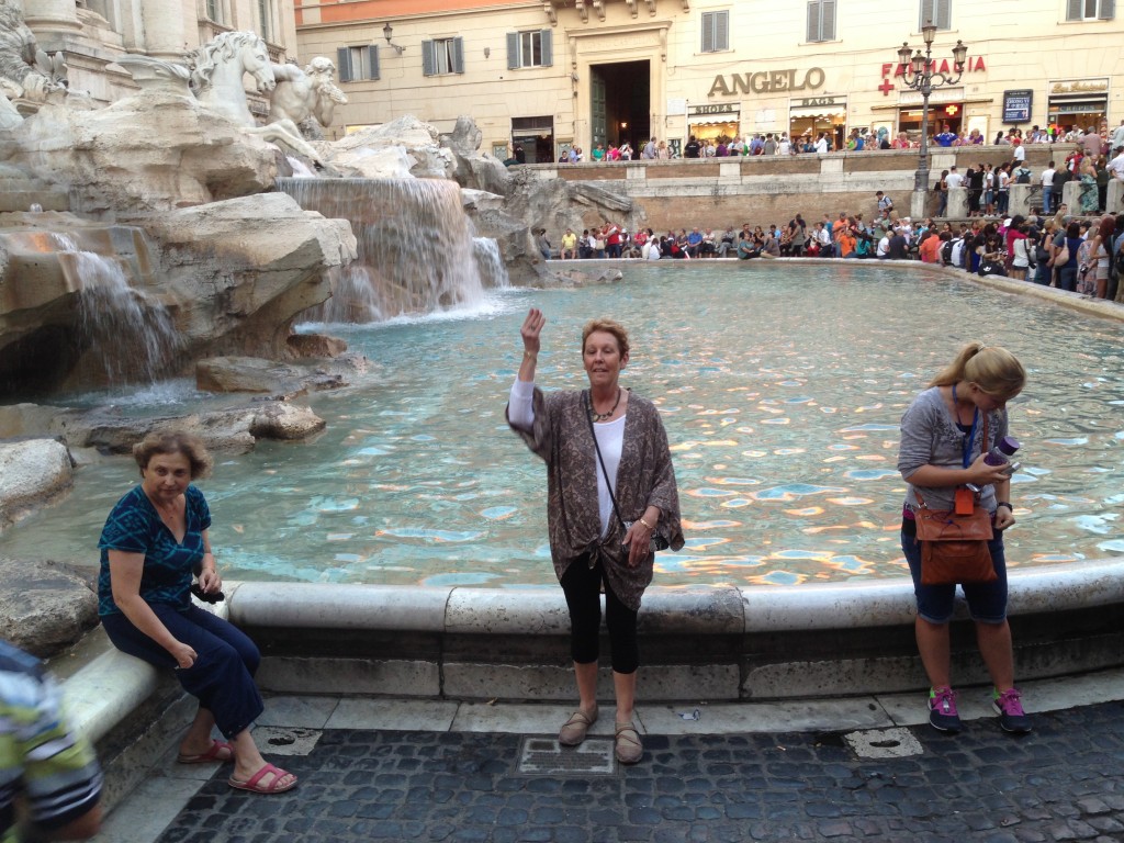 Pam throwing her 3 coins in the Trevi Fountain, Rome.  2013