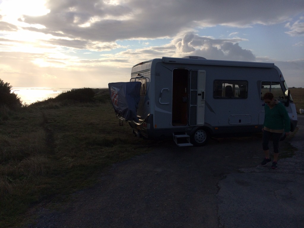 Our camper car at Longues-Sur-Mur, the Mulberry at Arromanches in the distance. France. 2014