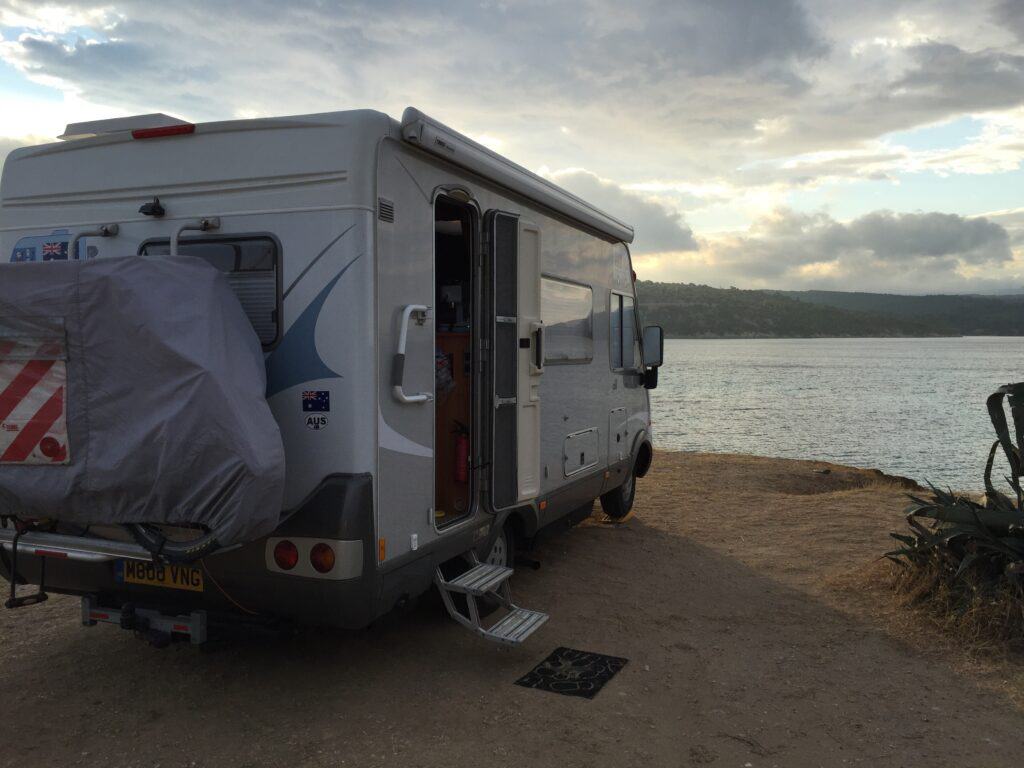 Pre-dust Storm photo of the Hymer at Agios Lionnos.  We I looked out in the morning I thought the black mat outside had blown away but it was buried in sand.