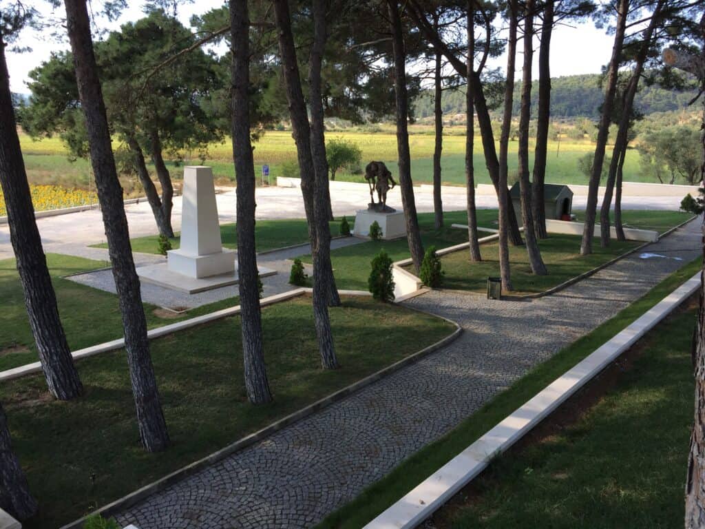 The beautiful gardens of the memorial. The bronze statue is very similar to the Diggers statue in Fromelles. 