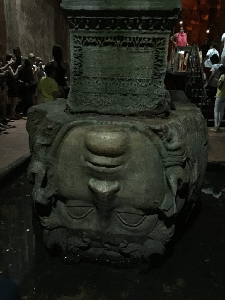 The base of this column is a large carving of a Gorgan 