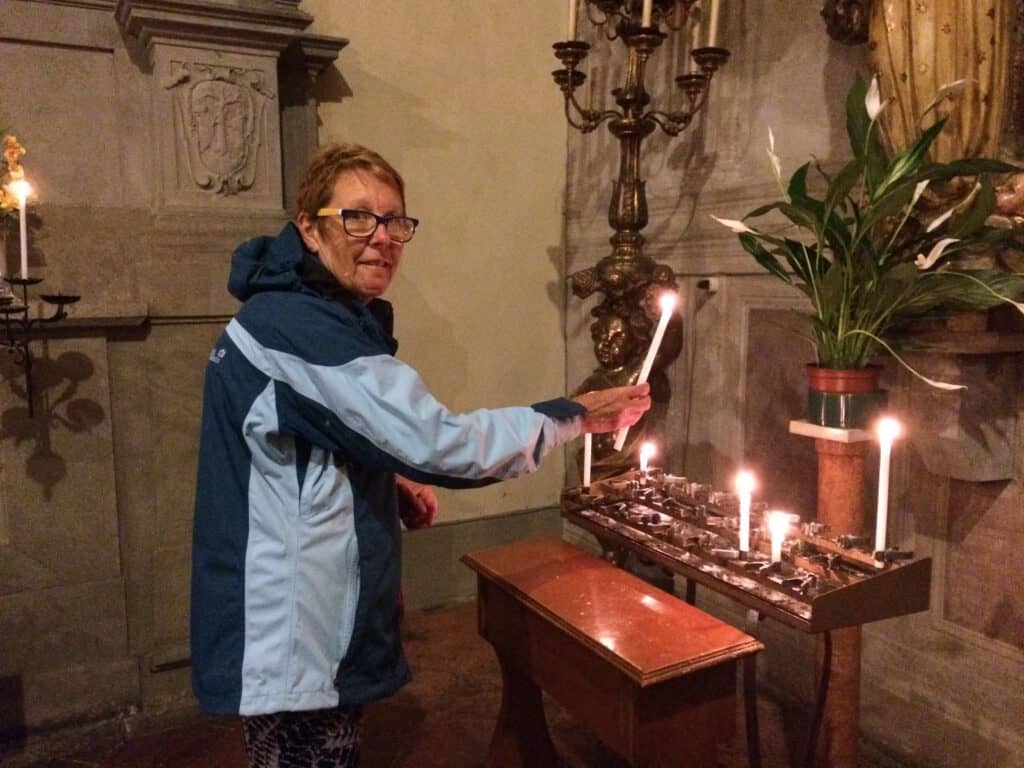 Pam cannot pass a church without a candle for Nicholas and Indiana.